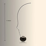  a silhouette design of a face lamp size nz