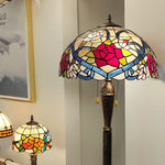 Tiffany-style stained glass lamp with floral design