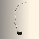 Silhouette of a floor lamp with a black shade NZ