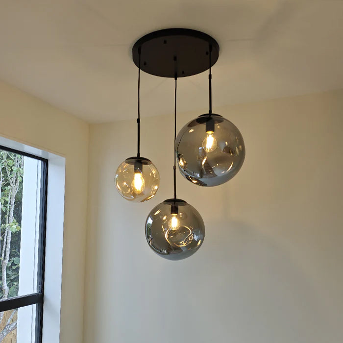 Ceiling light fixture with three glass shade hanging from the ceiling auckland