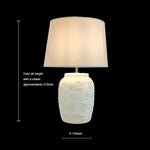 Table lamp with textured base and beige shade size