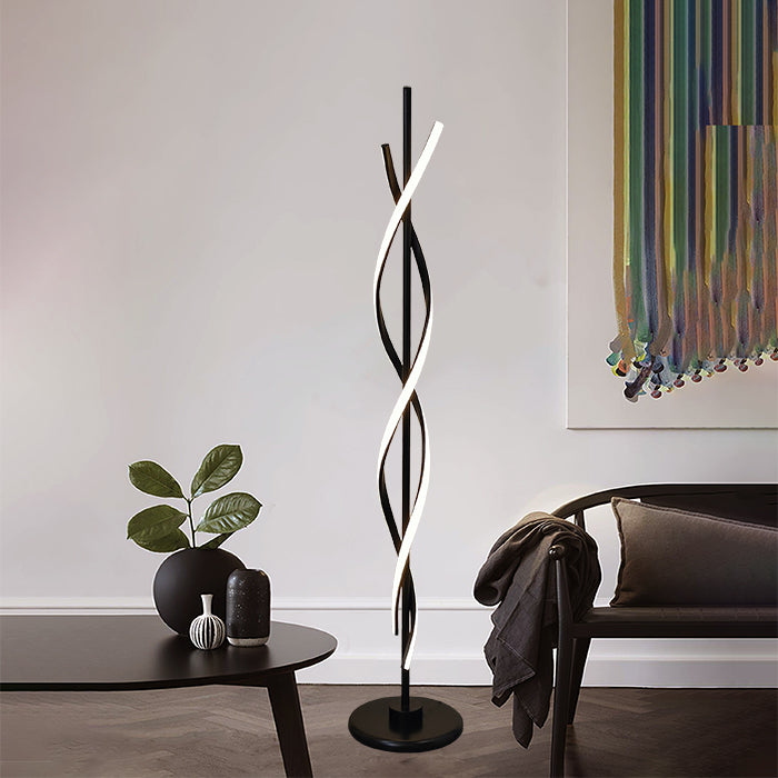 A modern black floor lamp with an abstract design standing in living room NZ