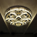 A modern chrome crystal LED ceiling chandelier with layered rings diffusing light auckland