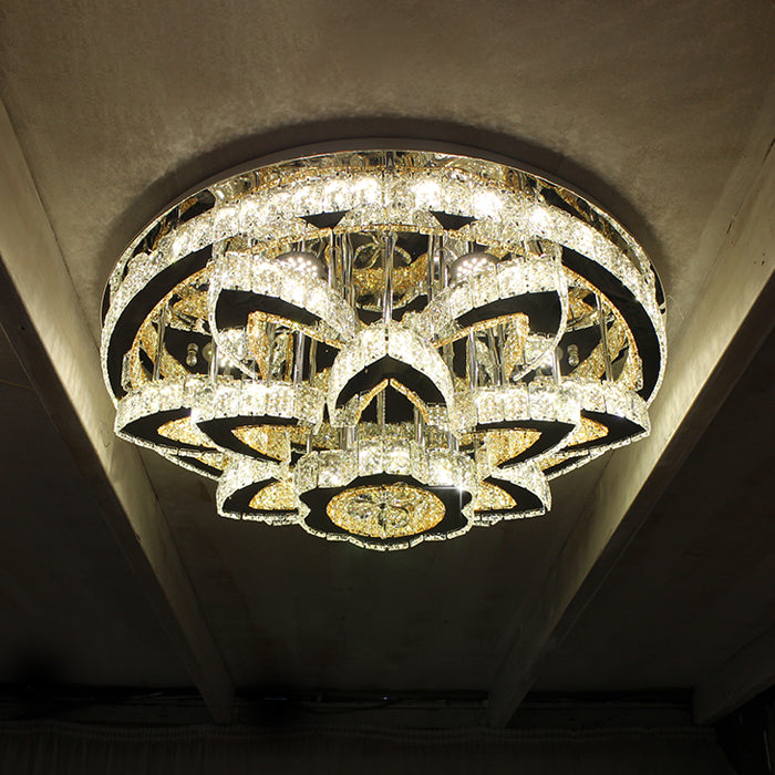 A modern chrome crystal LED ceiling chandelier with layered rings diffusing light auckland