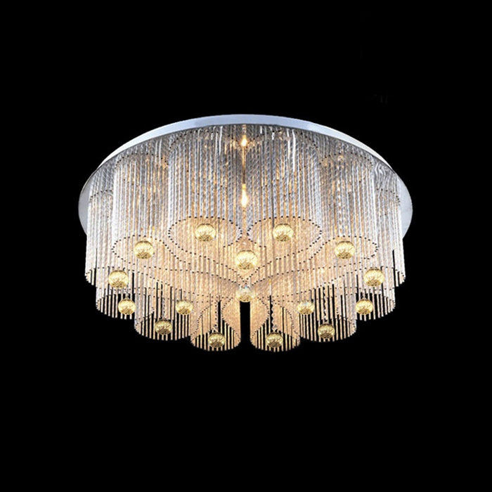 A modern ceiling light with a golden frame and clear crystal drops west auckland