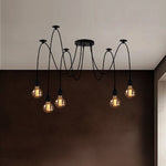 Modern chandelier with multiple hanging bulbs in a room setting nz