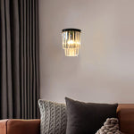 wall light fixture in a living room with a sofa and cushions auckland
