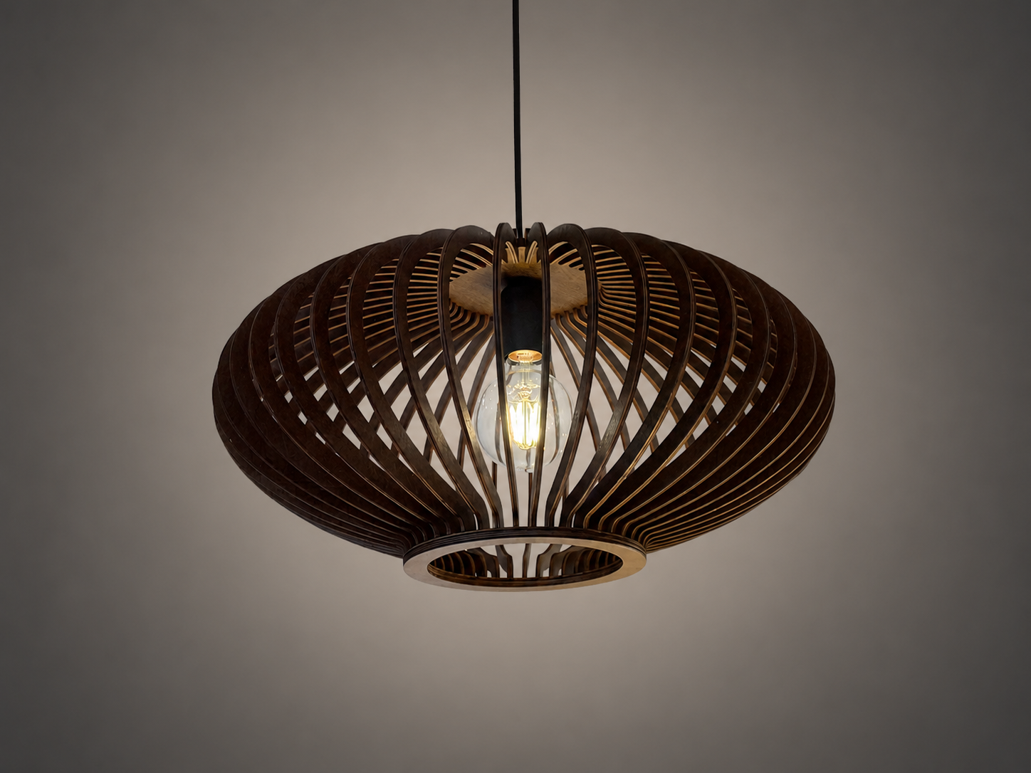 A modern pendant light fixture with a dark brown woven slatted shade and a glowing light bulb, suspended against a neutral gray background.
