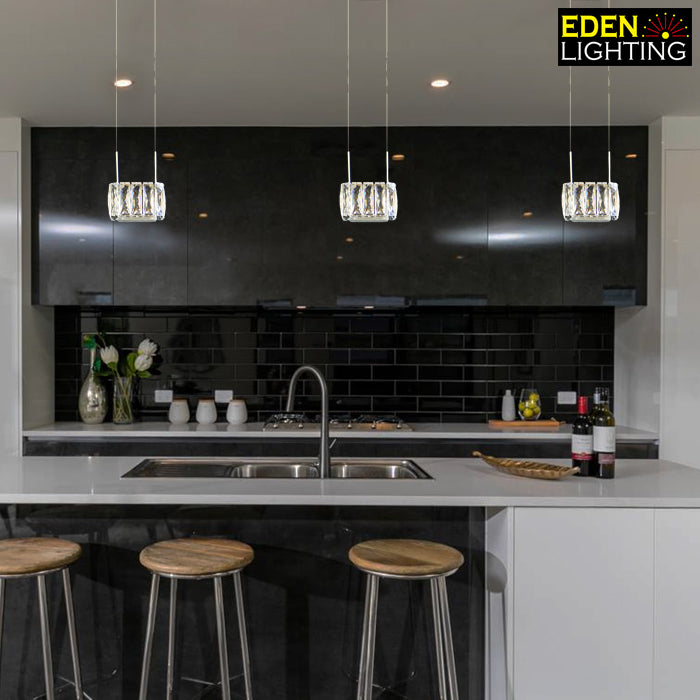 Modern kitchen with crystal pendant lights above island nz
